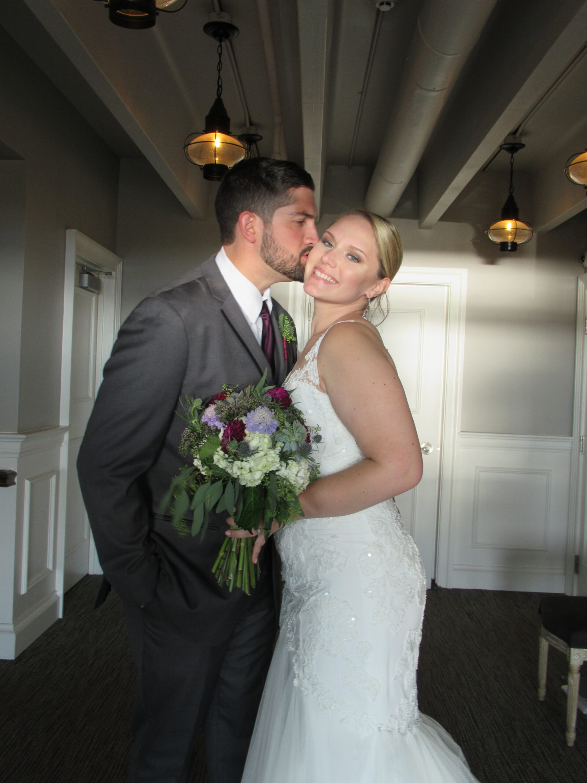 A man kissing the cheek of his wife